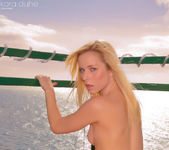 Kara stripteasing on the terrace pulling her bra 17