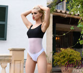 Jess Davies teasing in her black and white bodysuit outdoors 5