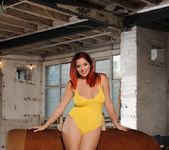 Lucy V teasing in her yellow bodysuit on the gym horse 5