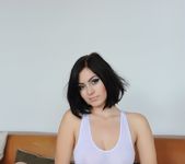 Summer teases on the couch in her see through white top