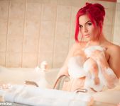 Harley plays in the tub and pours hot wax on her tits 8