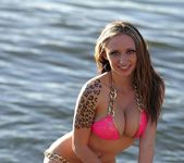 Lily strips and teases on the docks 14