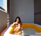 Lexi Dona takes a dip in her paddling pool - Lexi Dona 17