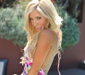 Tasha Reign outside using her hips really well with a hula h 4