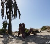 Natalie K - Playing and wetting on the public beach 8