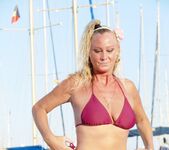 Natalie K - Bikini strip on a boat in the marina 9