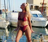 Natalie K - Bikini strip on a boat in the marina 11
