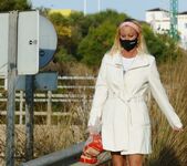 Flashing outside in long coat crop top and panties