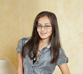 Sima - teen with glasses oiling up her pussy