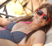 Gorgeous Hailey Leigh shows her tits while lounging poolside 7