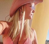 Fingering outside on my balcony in pink bikini top and cowgi 8