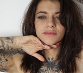 Tattooed brunette with natural tits 16