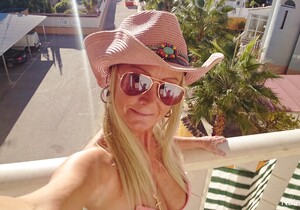 Fingering outside on my balcony in pink bikini top and cowgi - MILF Sexy Gallery