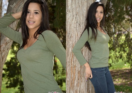 Bella teases and poses in the tree - Solo Image Gallery